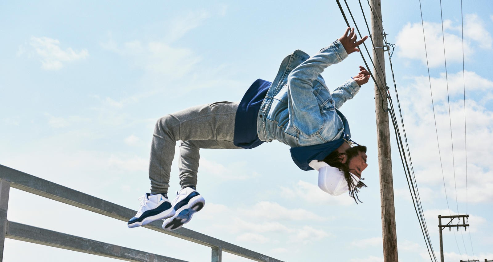 Guy doing a backflip wearing the AJXI